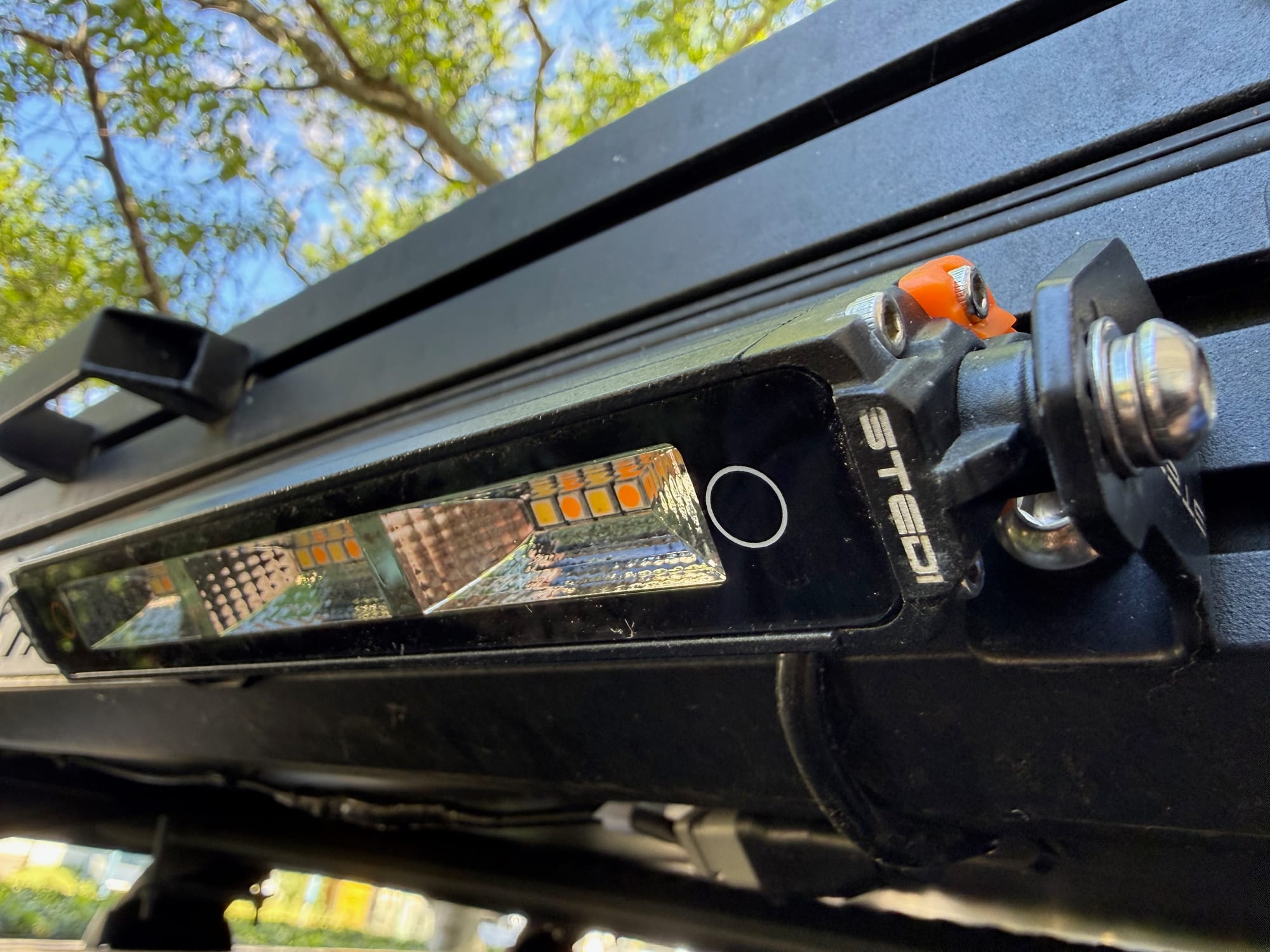 Close-up of the Stedi Micro Touch with the round touch button on the lens, next to the LEDs