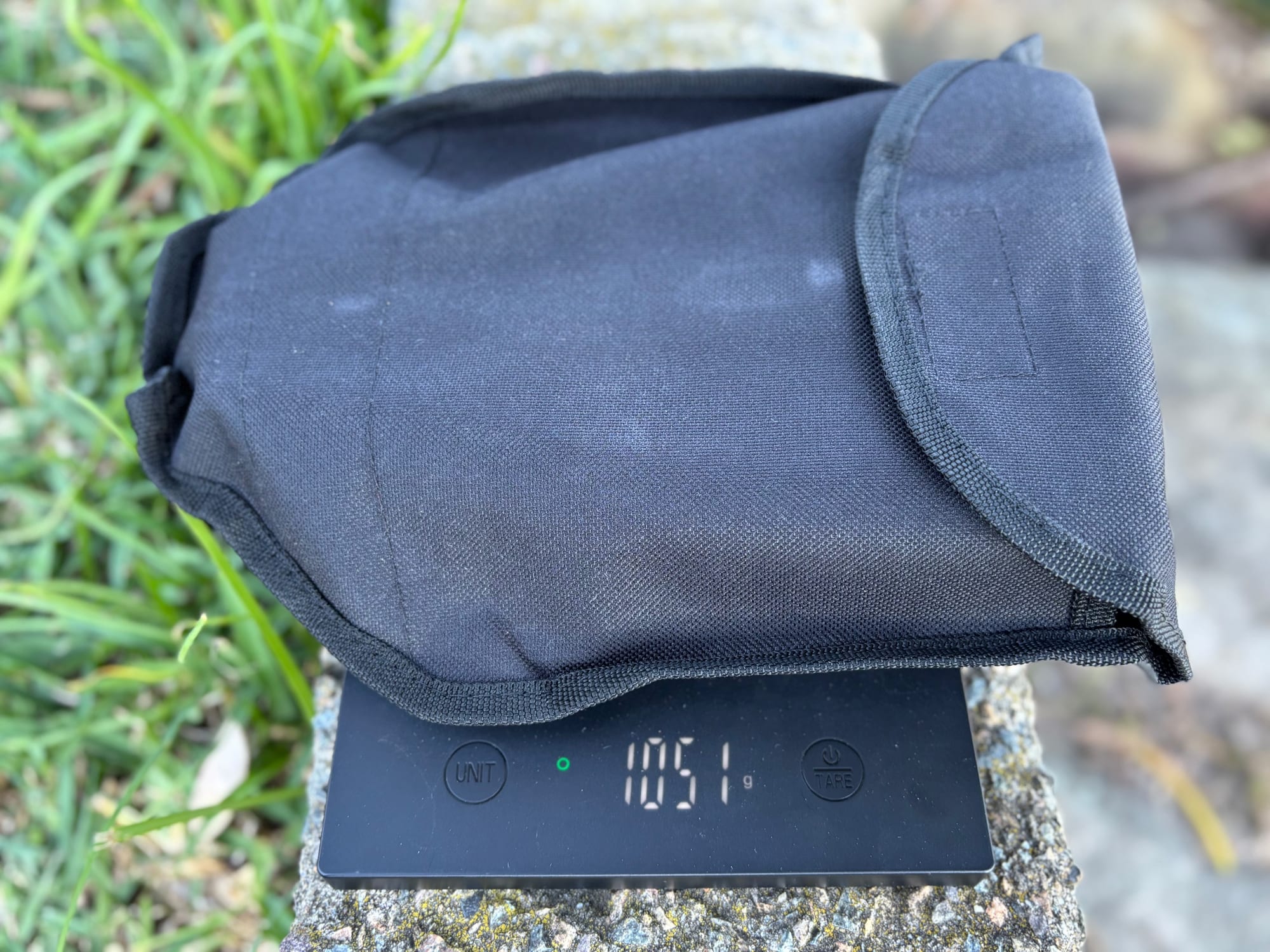 The Wanderer shovel in its pouch on our scale, showing 1,051 g