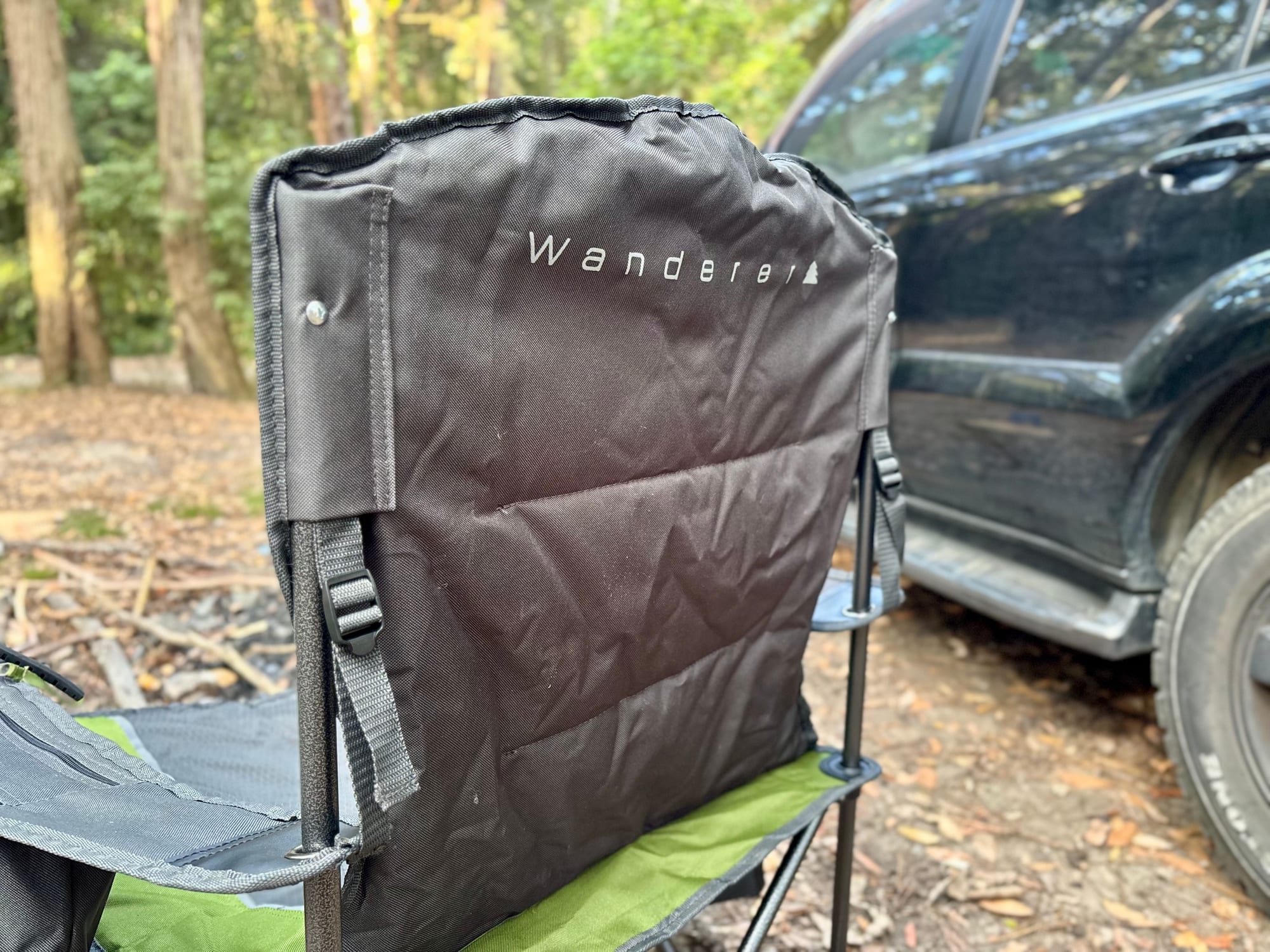 The back of the Wanderer Premium chair, with the straps and buckles that adjust the armrest height