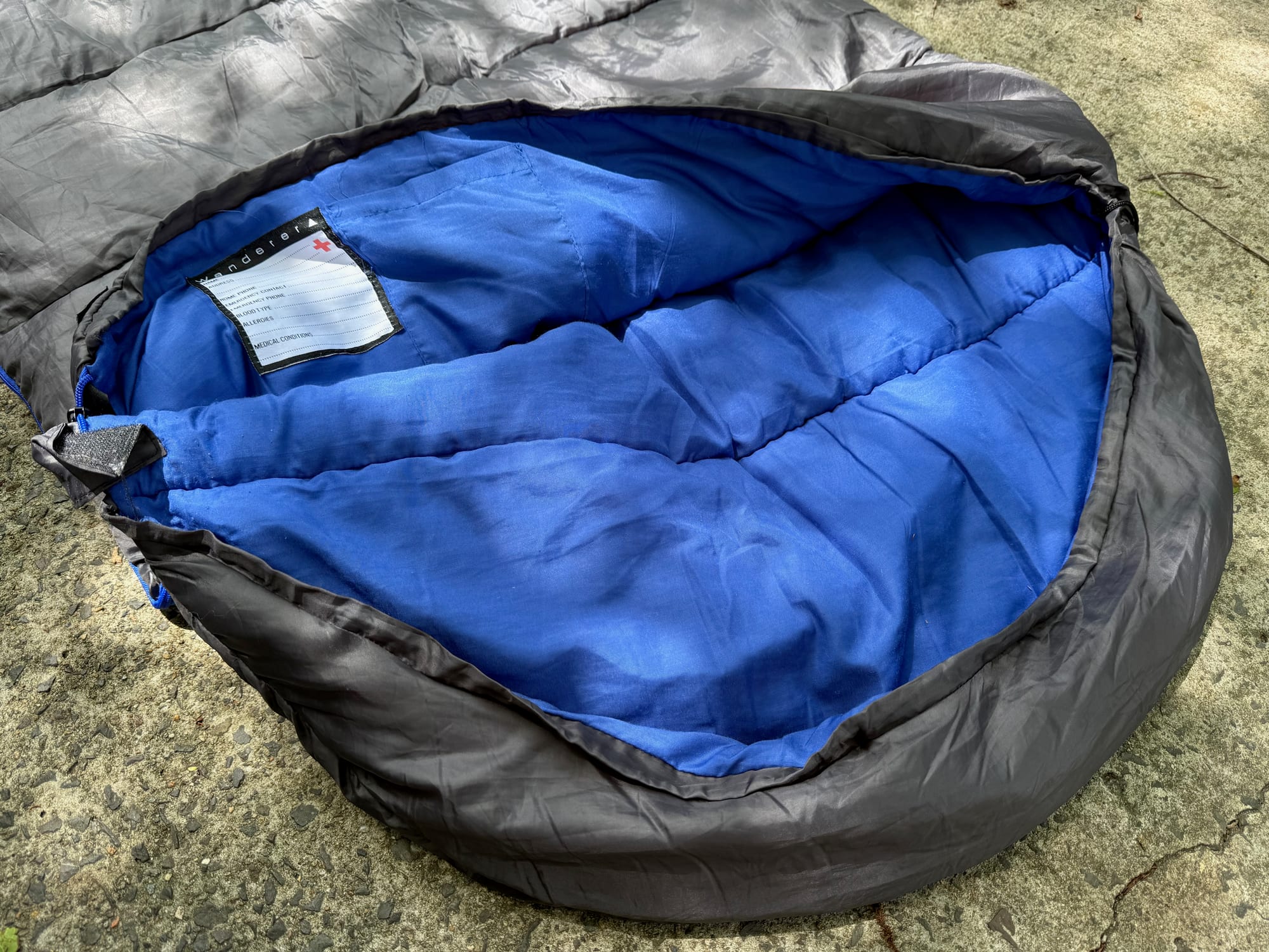 The hood of the Wanderer sleeping bag opened up, showing the blue lining