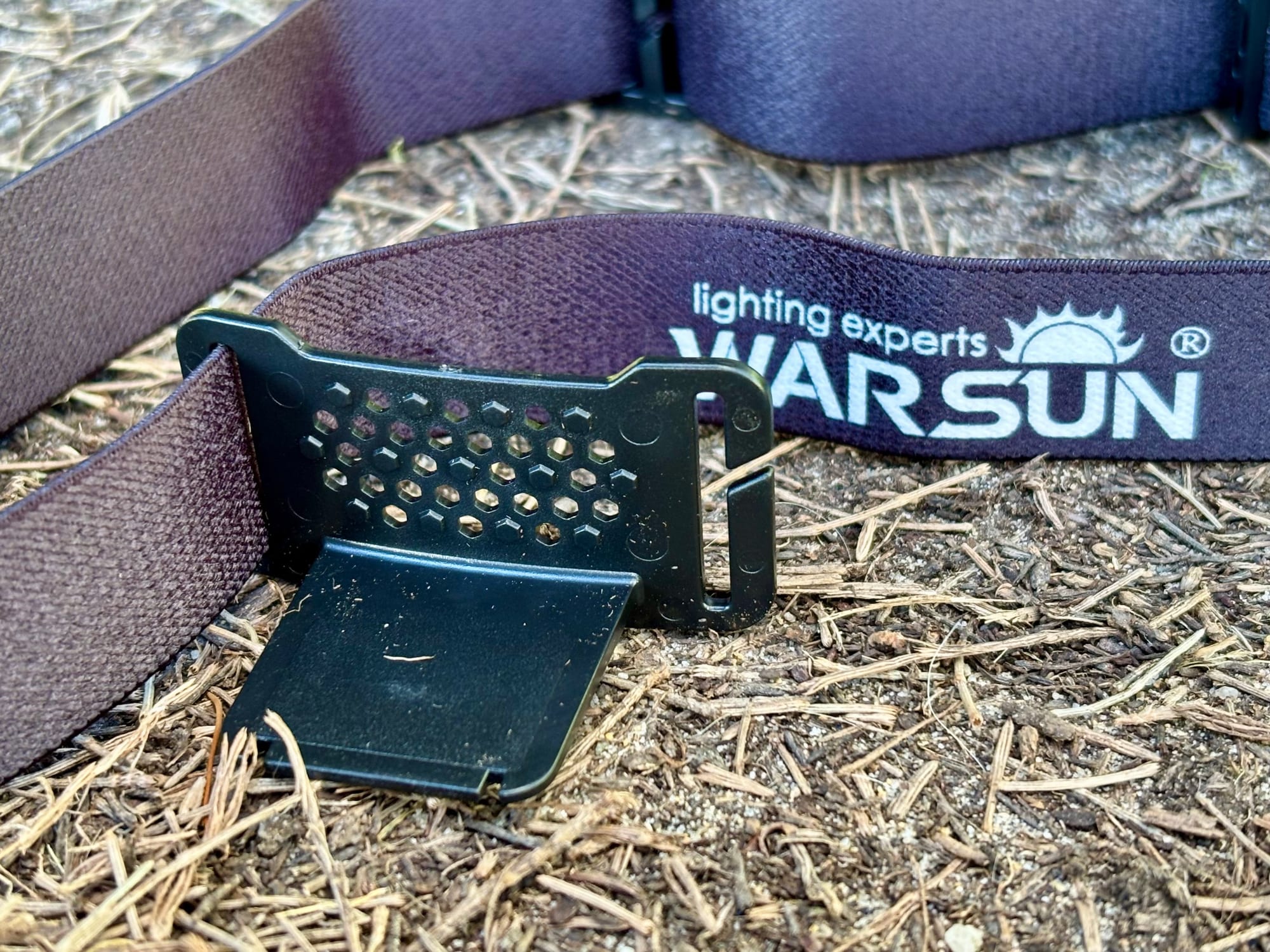 The clip plate for the Warsun headlamp on its elastic headband