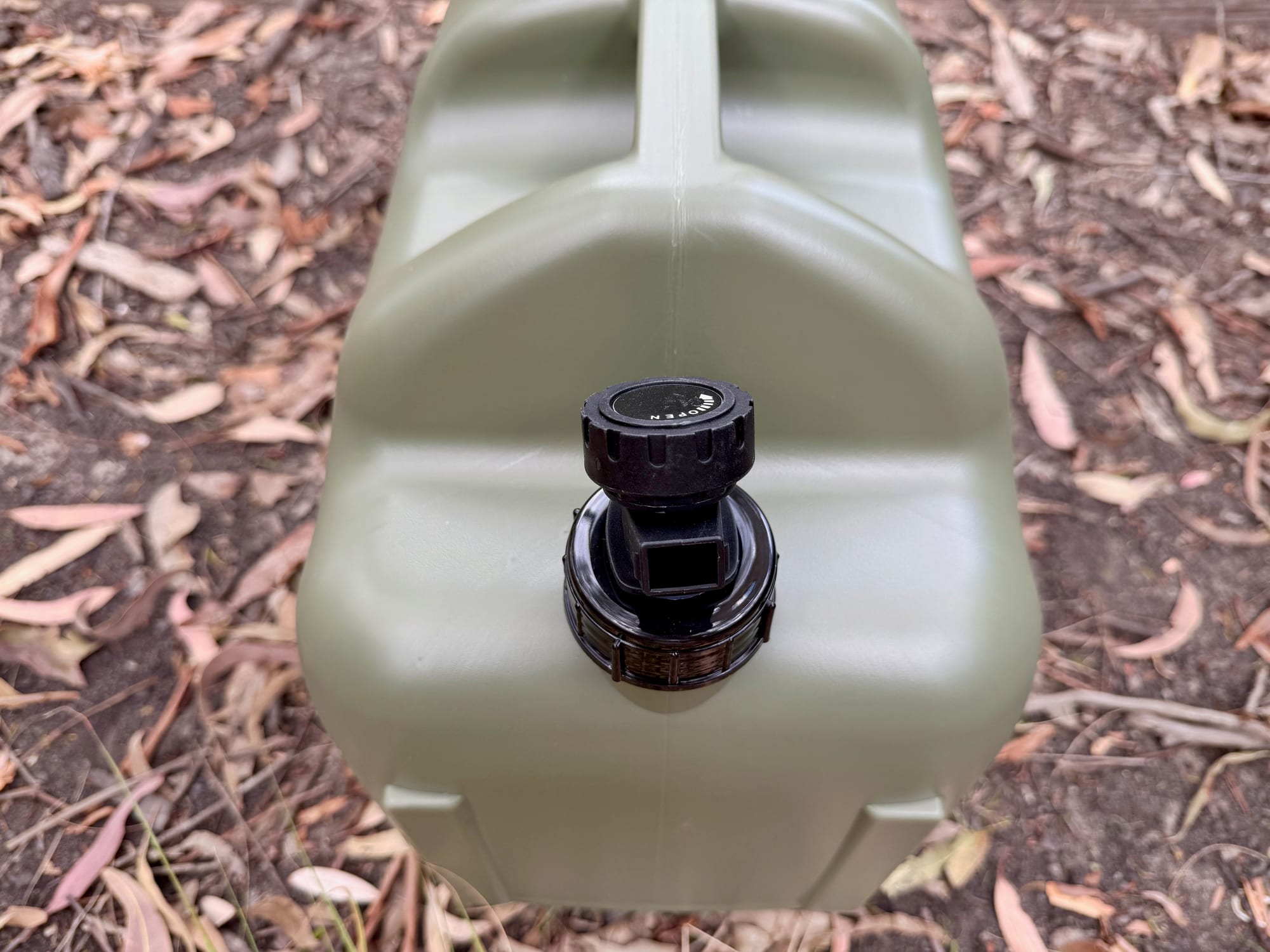 The tap on the smaller opening of the container