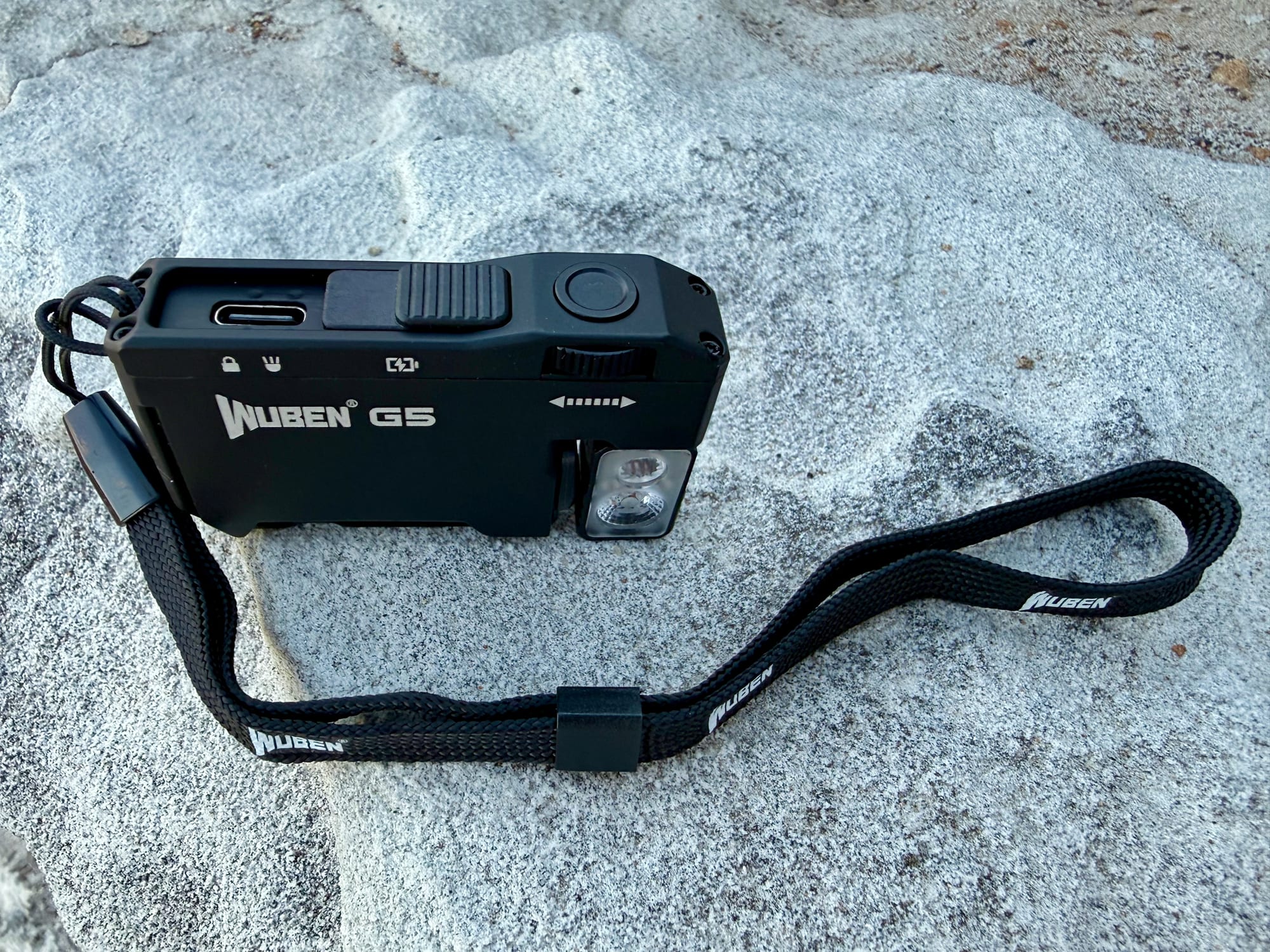 The Wuben G5 with its lanyard attached and the USB-C port uncovered