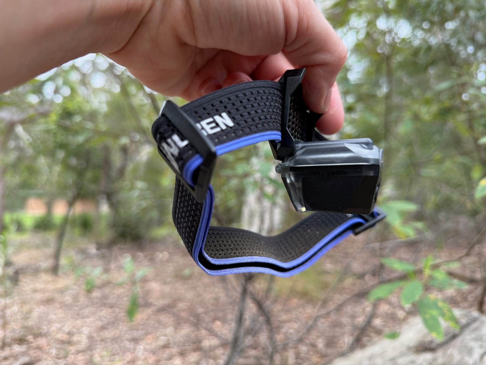 The Wuben H4 lamp tilted down a full 90 degrees on its headband