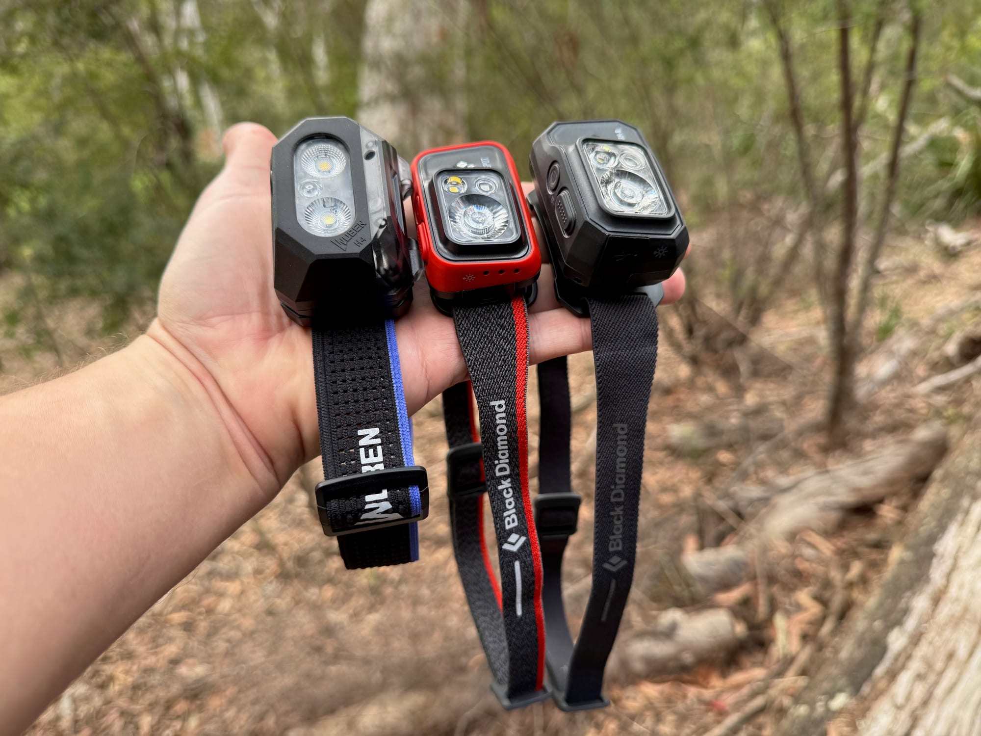The Wuben H4, the Spot 400 and the Storm 500-R held side by side in one hand