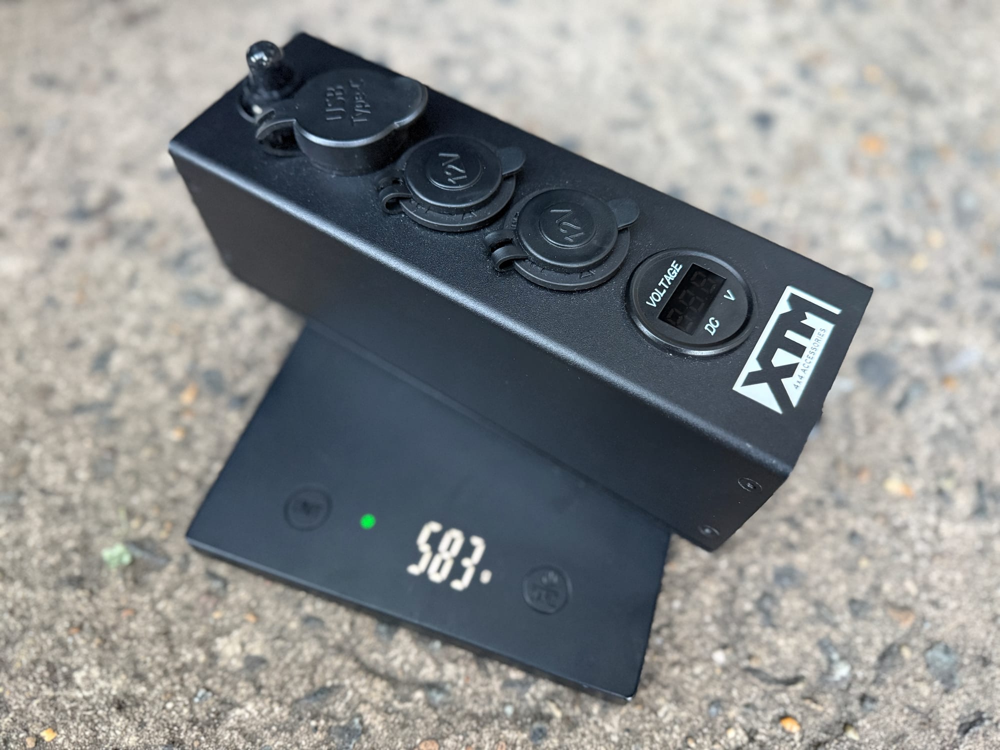 The XTM Distribution Panel on the scale at 583 g