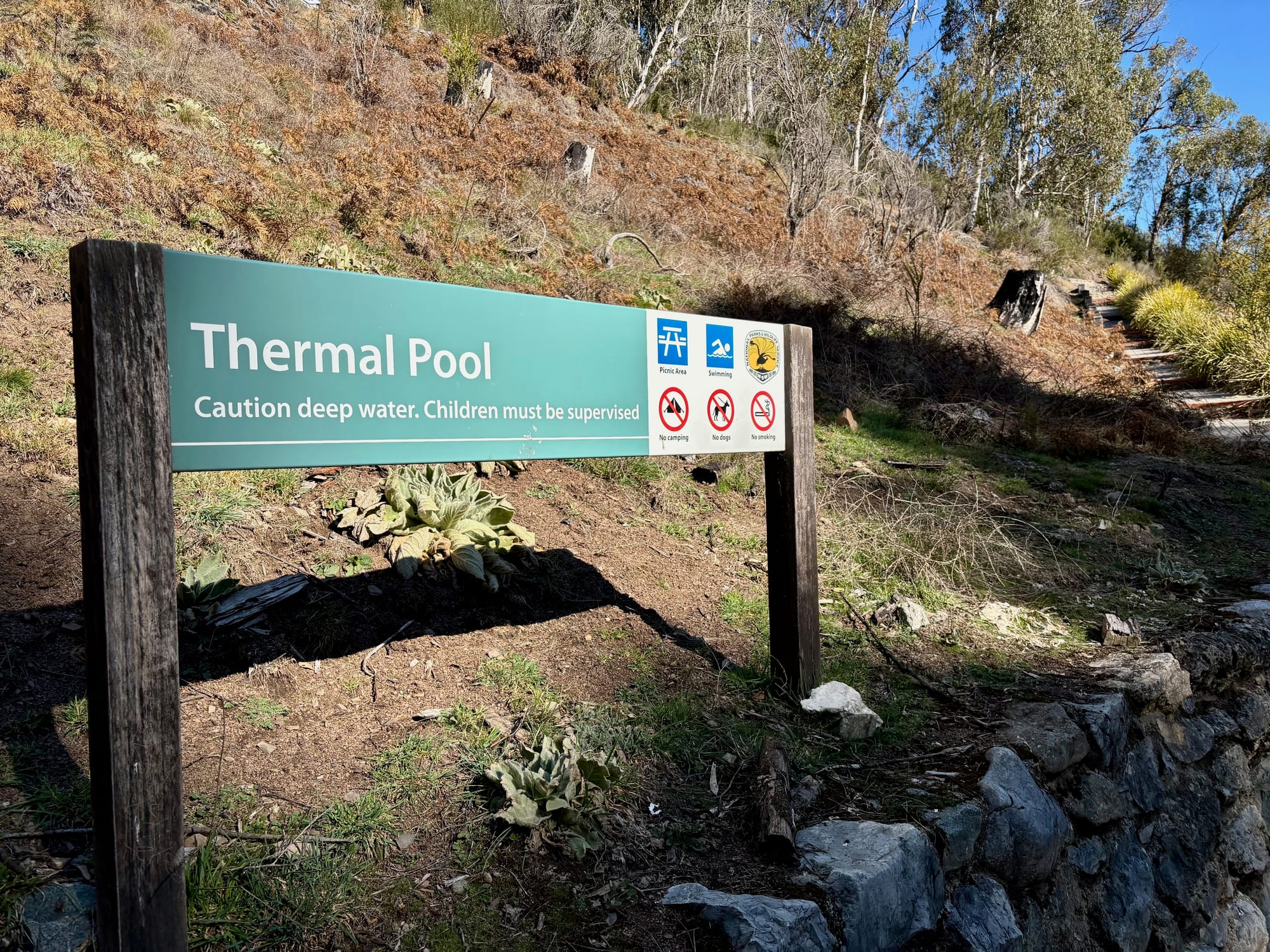 The Thermal Pool sign: caution deep water, children must be supervised