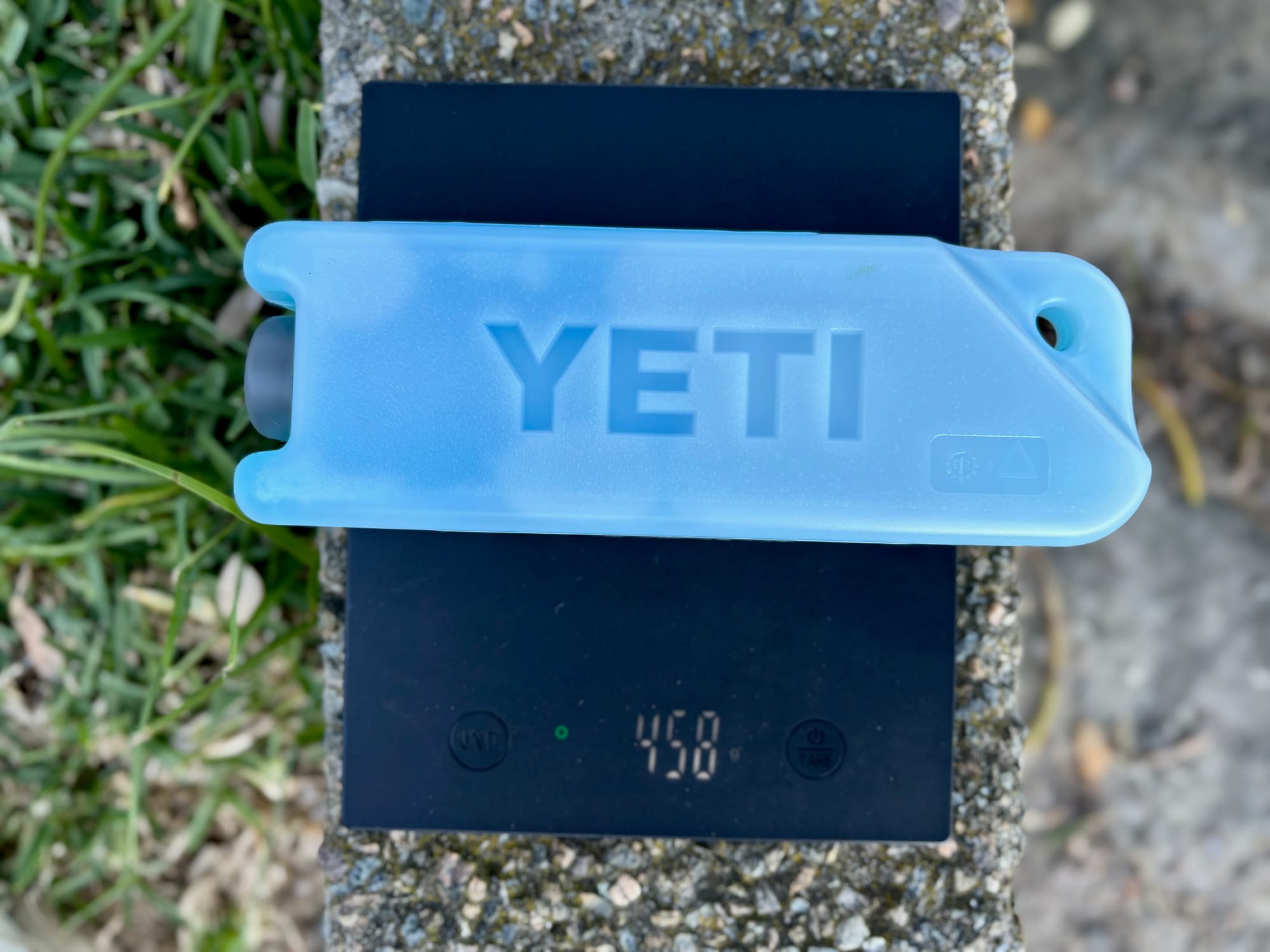 The YETI Ice Block on a scale showing 458 g