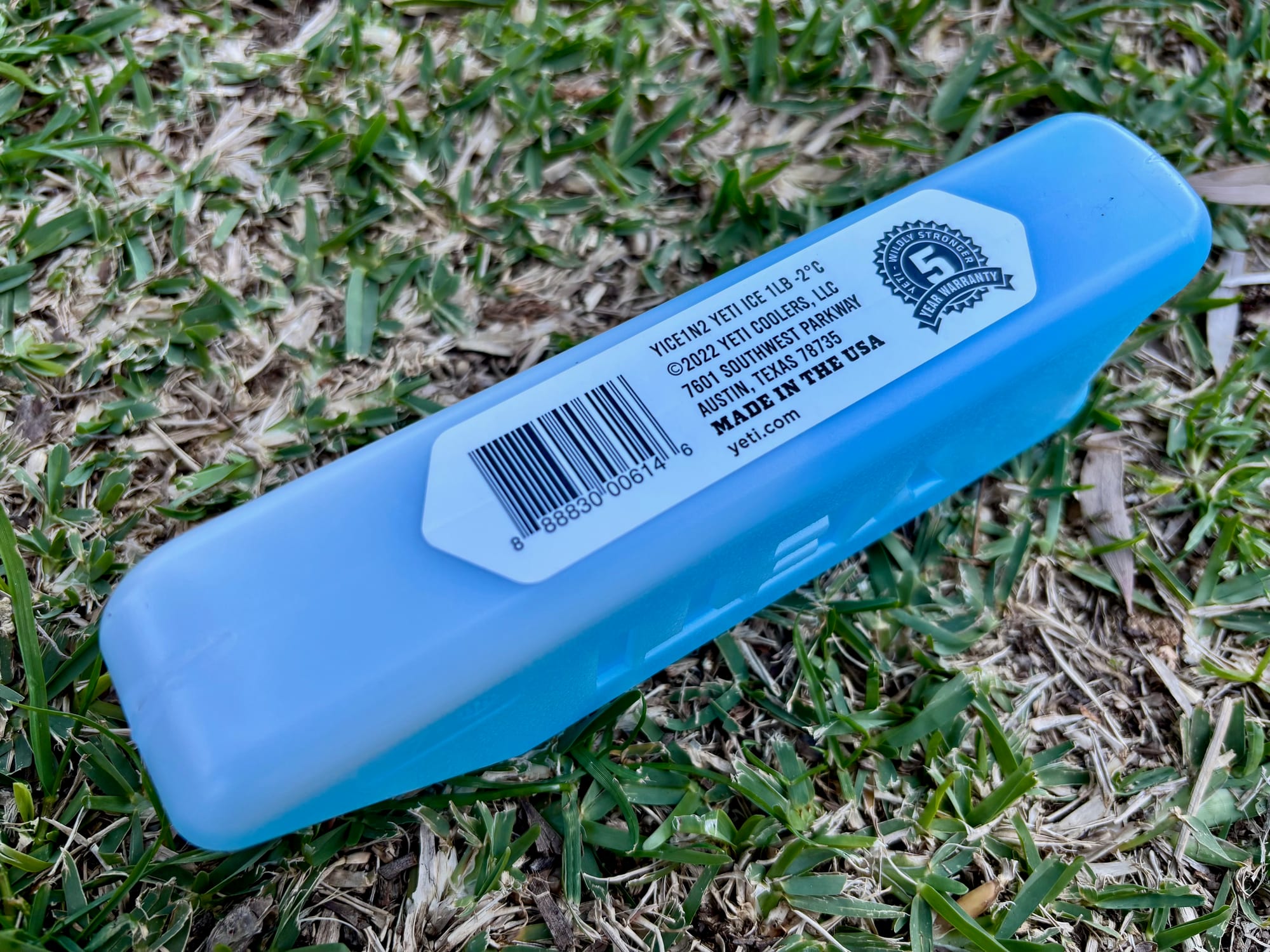 The white label on the edge of the YETI Ice Block with a 5 year warranty seal and Made in the USA