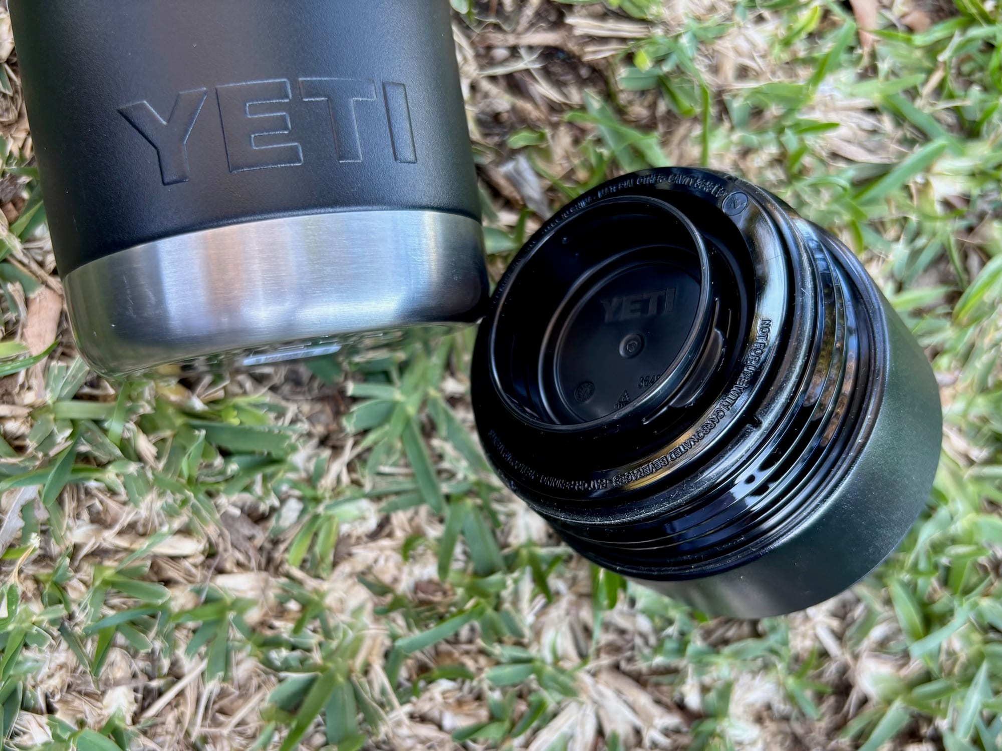 The HotShot cap unscrewed and lying next to the bottle