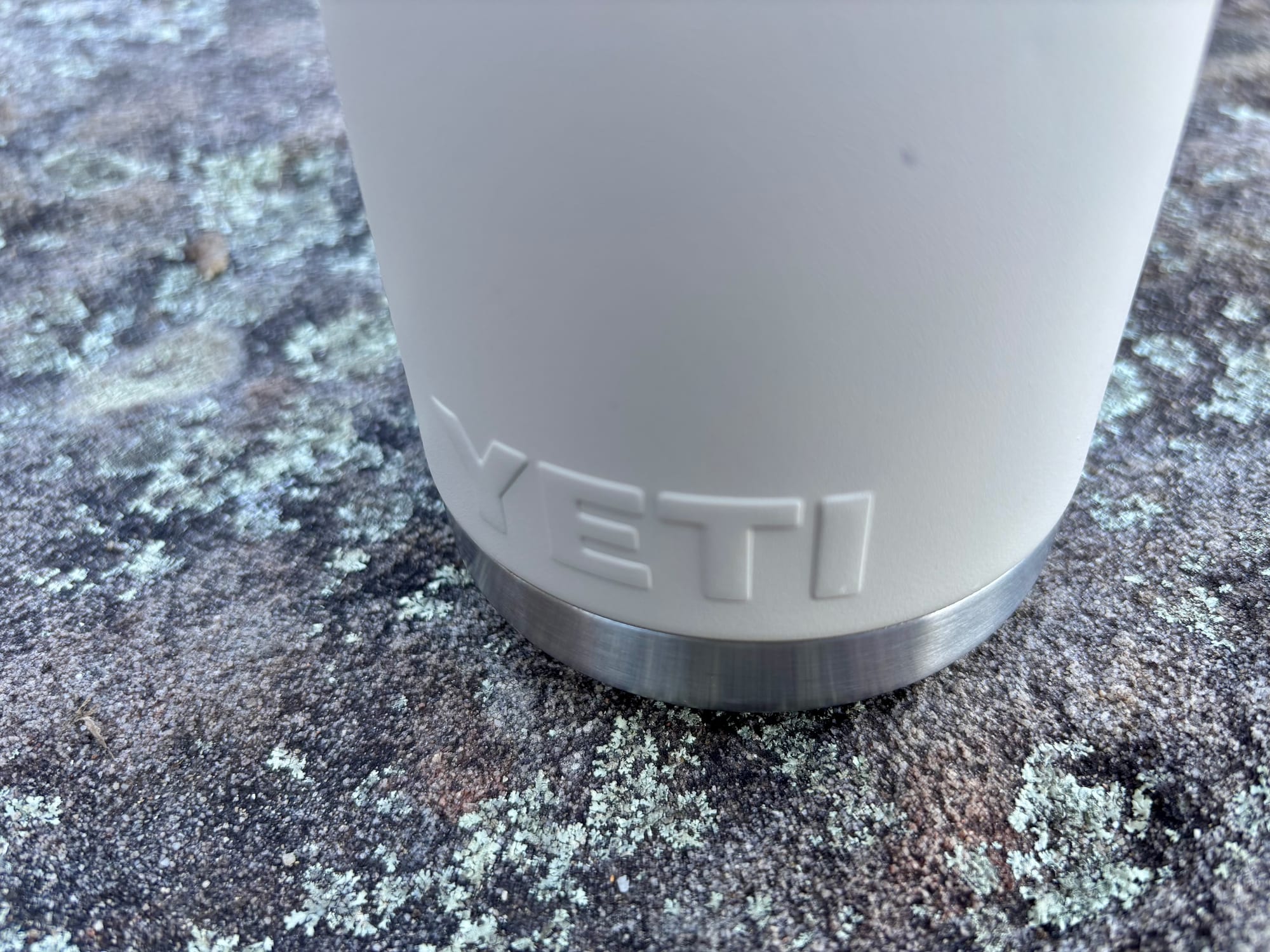The Cape Taupe DuraCoat finish and the embossed YETI logo at the base of the bottle
