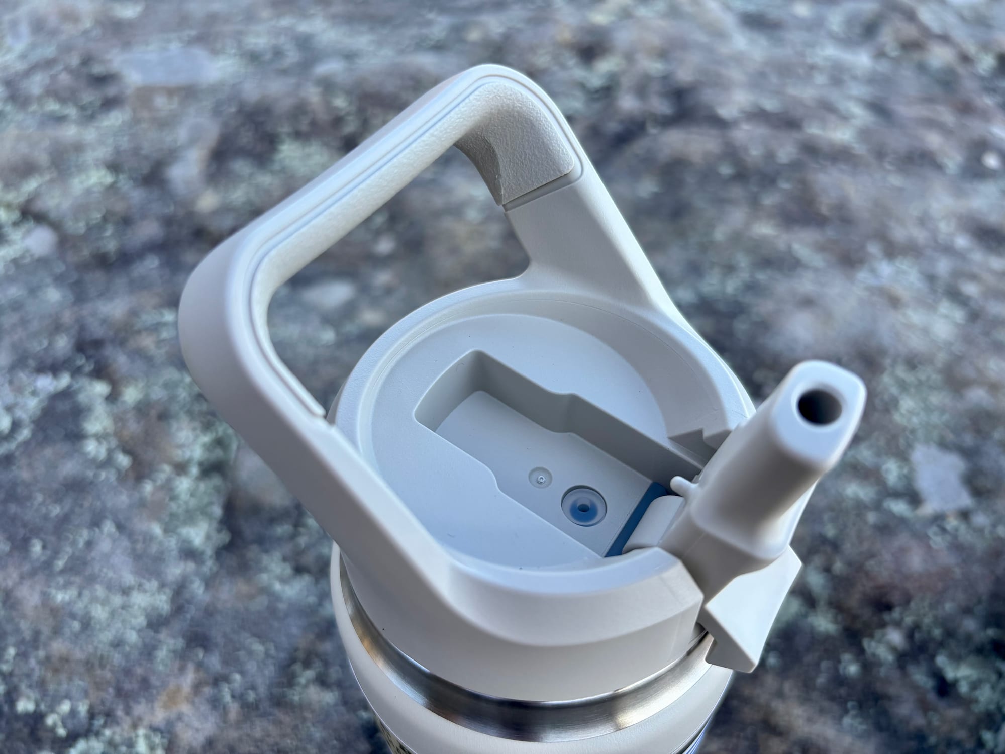 The spout of the straw cap flipped open, seen from above
