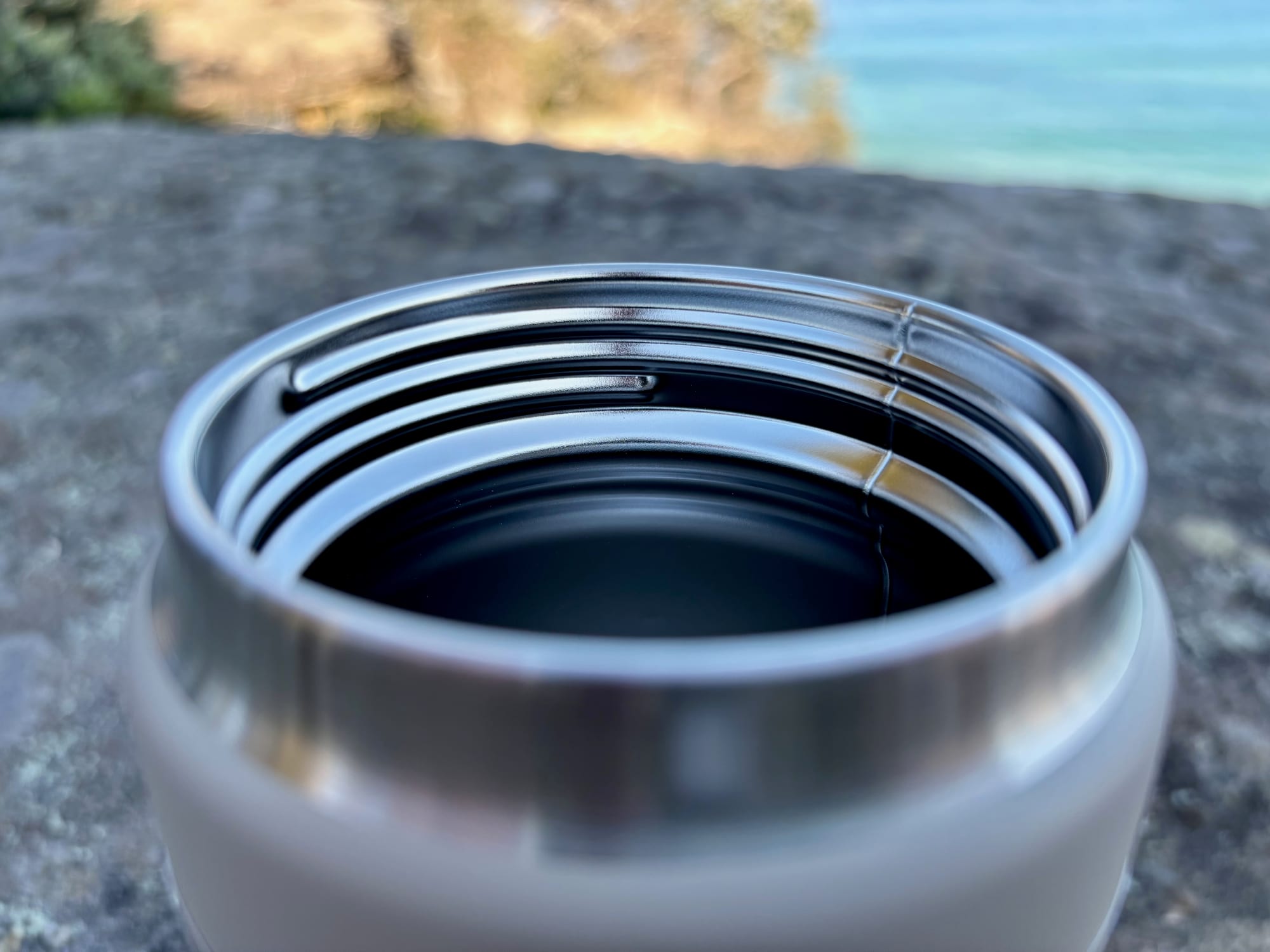 The wide stainless steel mouth of the YETI Rambler 26 oz bottle