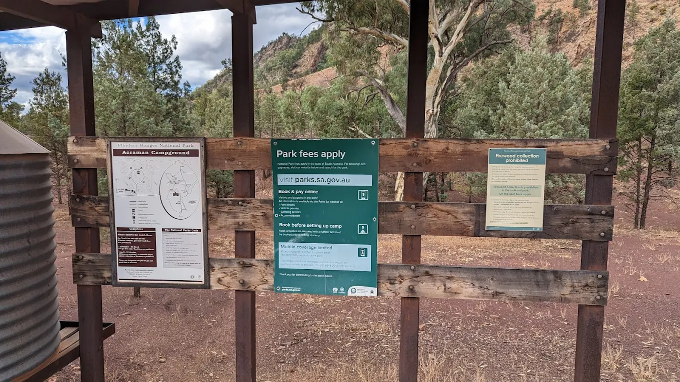 The information board at Acraman Campground with park fees and booking details