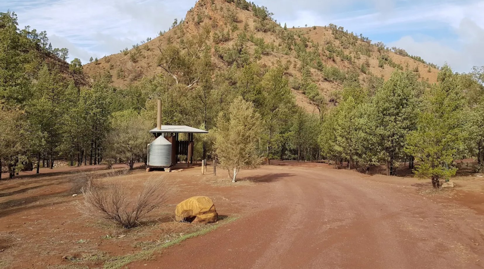 The long-drop toilet at Acraman Campground, with the range behind