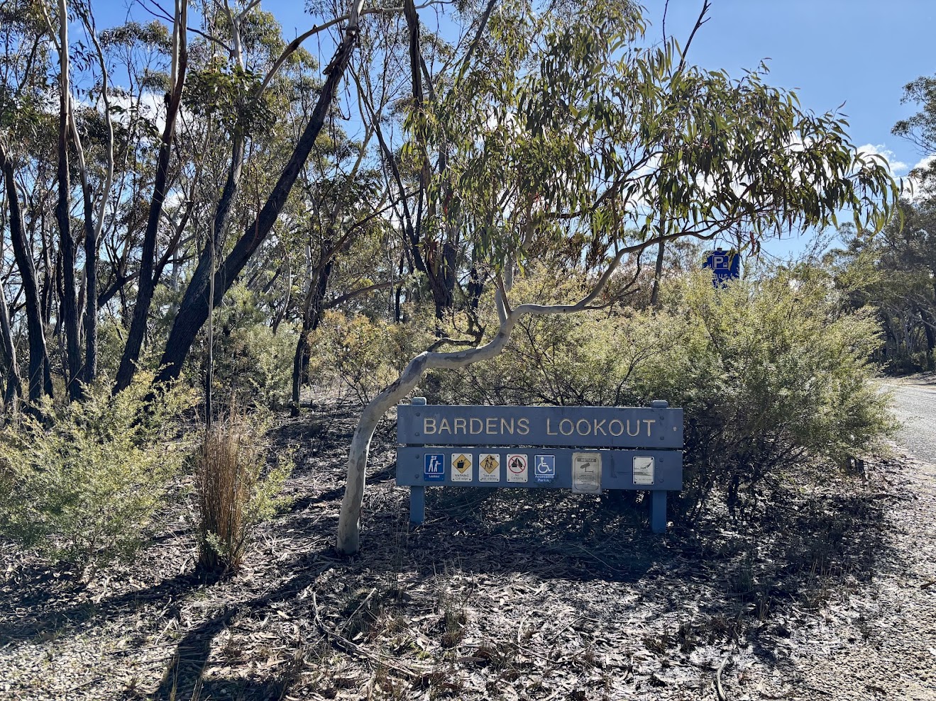 The Bardens Lookout sign at the entrance among the trees