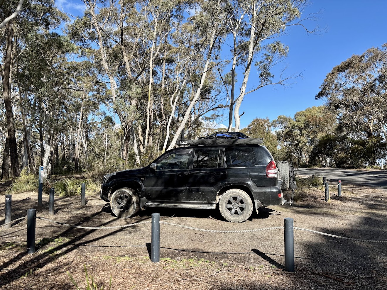 Our 4WD in a camping bay at Mount York Campground, with log barriers