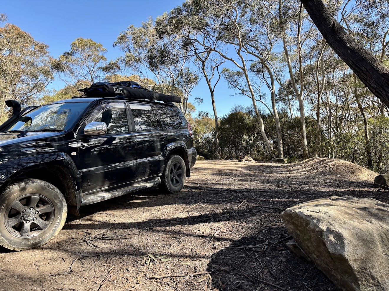 Our 4WD parked beside a sandstone block at Mount York Campground